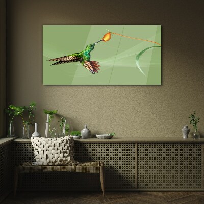 Hummingbird at a flower Glass Wall Art