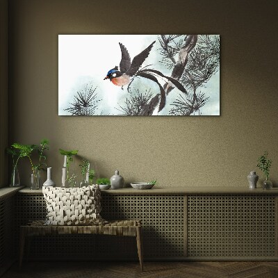 A bird in flight over the pines Glass Wall Art