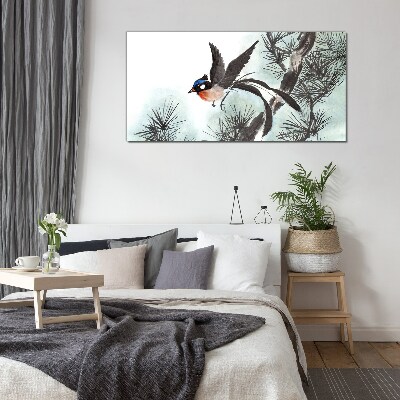 A bird in flight over the pines Glass Wall Art