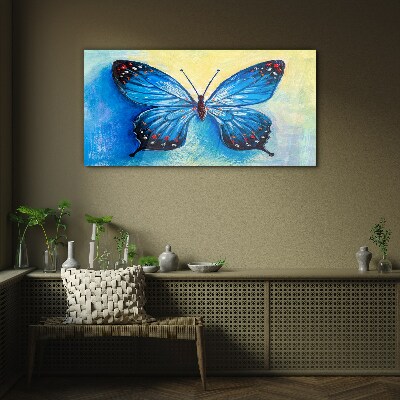 Blue butterfly on abstract background Glass Wall Art