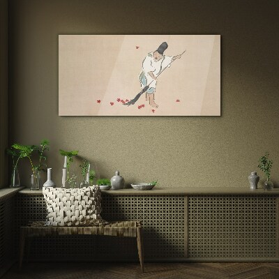 Monk cleaning with leaves Glass Wall Art