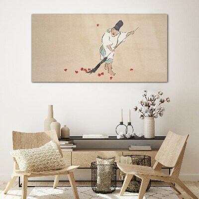 Monk cleaning with leaves Glass Wall Art
