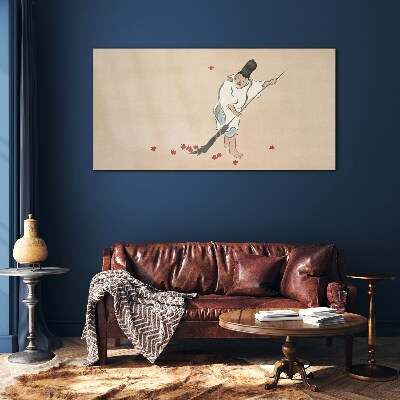Monk cleaning with leaves Glass Wall Art