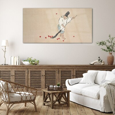 Monk cleaning with leaves Glass Wall Art