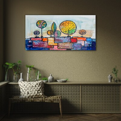 Colorful trees in an abstract landscape Glass Wall Art