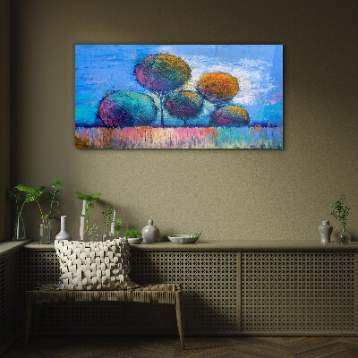 Colorful trees on a blue background Glass Print