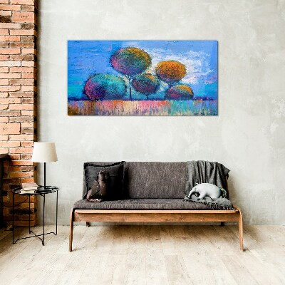 Colorful trees on a blue background Glass Print