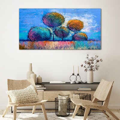 Colorful trees on a blue background Glass Print