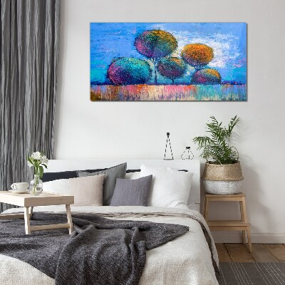 Colorful trees on a blue background Glass Print
