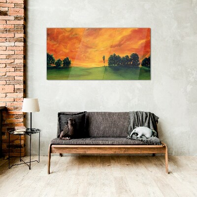 Sunset over the green hill Glass Print