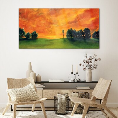 Sunset over the green hill Glass Print
