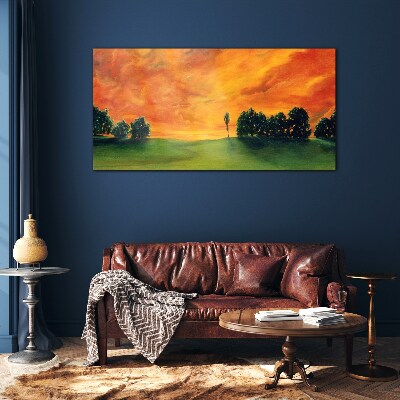 Sunset over the green hill Glass Print