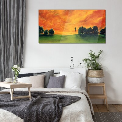 Sunset over the green hill Glass Print
