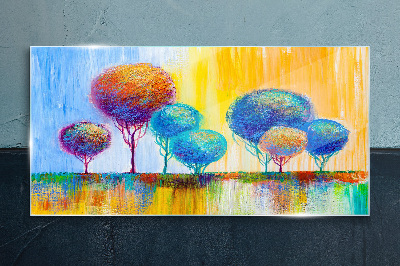 Colorful trees in the sunset light Glass Print