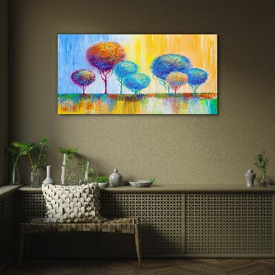Colorful trees in the sunset light Glass Print