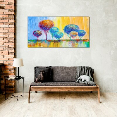 Colorful trees in the sunset light Glass Print