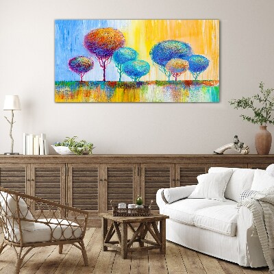 Colorful trees in the sunset light Glass Print