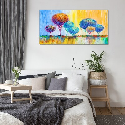 Colorful trees in the sunset light Glass Print