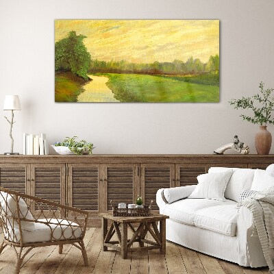 A peaceful landscape with a river and trees Glass Print