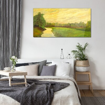 A peaceful landscape with a river and trees Glass Print