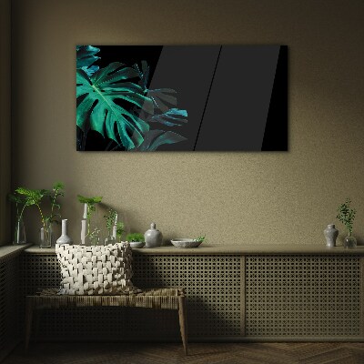 Green leaves on a black background Glass Print