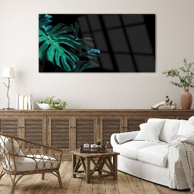 Green leaves on a black background Glass Print