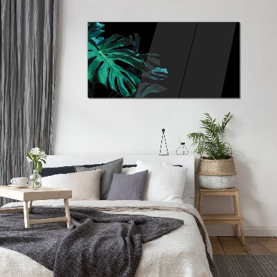 Green leaves on a black background Glass Print