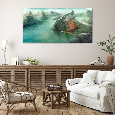 Eagle over a mountain lake Glass Print