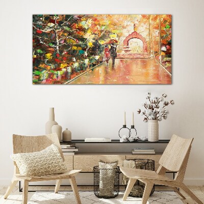 Autumn alley with umbrellas Glass Print