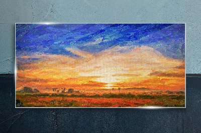 Sunset over a rural landscape Glass Print