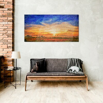 Sunset over a rural landscape Glass Print