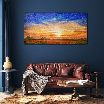 Sunset over a rural landscape Glass Print