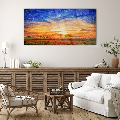 Sunset over a rural landscape Glass Print