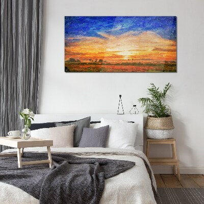 Sunset over a rural landscape Glass Print