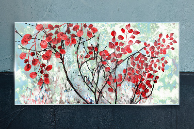 Red leaves on a blue background Glass Print