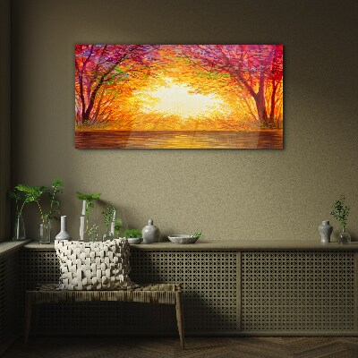 Sunset in a colorful forest Glass Print