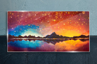 Sunset over a mountain lake Glass Print