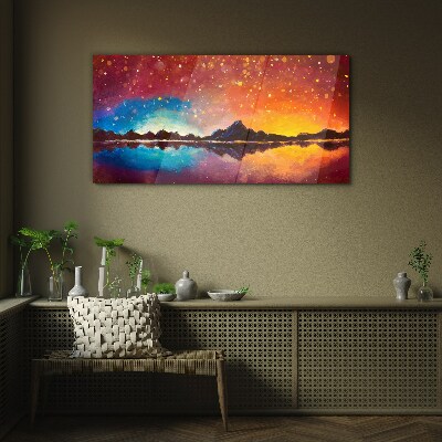 Sunset over a mountain lake Glass Print