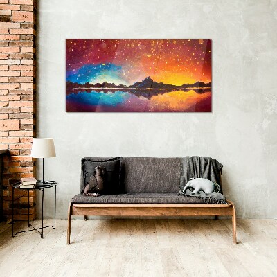 Sunset over a mountain lake Glass Print