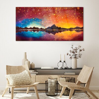 Sunset over a mountain lake Glass Print