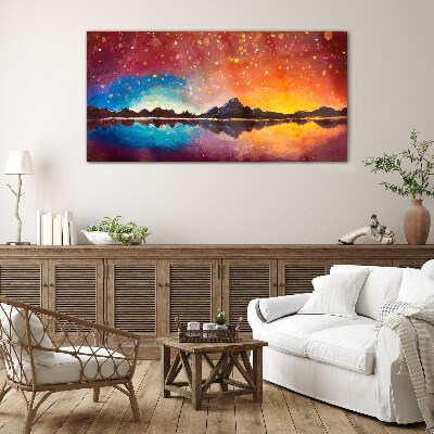 Sunset over a mountain lake Glass Print