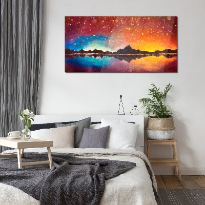 Sunset over a mountain lake Glass Print
