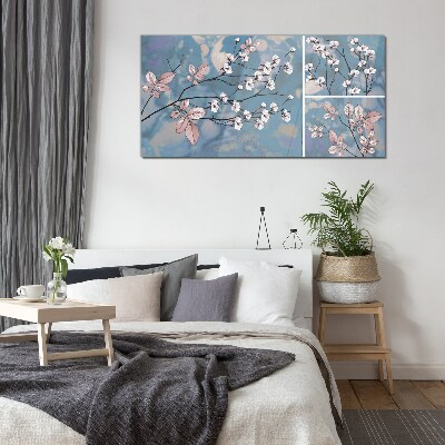 Floral branches on a blue background Glass Print