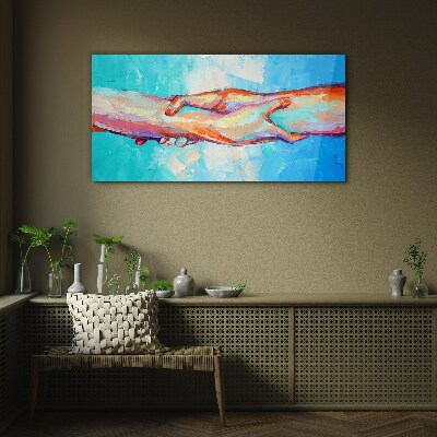 Uniting hands in color Glass Print