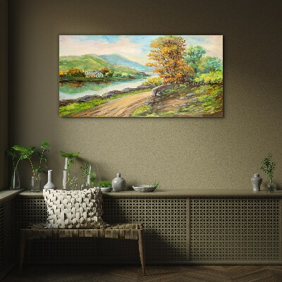 A peaceful landscape by the river Glass Print