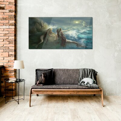 Mermaids on the seashore Glass Print