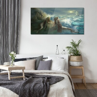 Mermaids on the seashore Glass Print