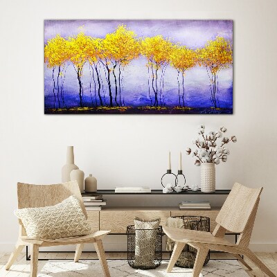 Golden trees in a purple landscape Glass Print