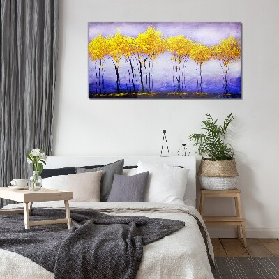 Golden trees in a purple landscape Glass Print