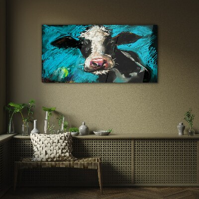 Portrait of a cow on a blue background Glass Wall Art